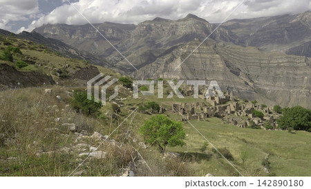 Elderly Shepherd Leading Flock Through Timeless Stone Village Surrounded By Layered Canyon Walls. Creative Elderly Shepherd Leading Flock Through Timeless Stone Village Surrounded By Layered Canyon Walls. Creative 142890180
