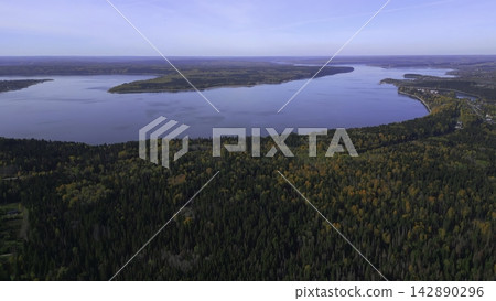 Drone Captures Peaceful Island Landscape Featuring Reflective Waters And Colorful Fall Foliage. Clip Drone Captures Peaceful Island Landscape Featuring Reflective Waters And Colorful Fall Foliage. Clip 142890296