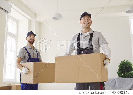 Delivery service, shipping specialists for transporting, men carrying cardboard boxes, move Delivery service, shipping specialists for transporting, men carrying cardboard boxes, move 142890342