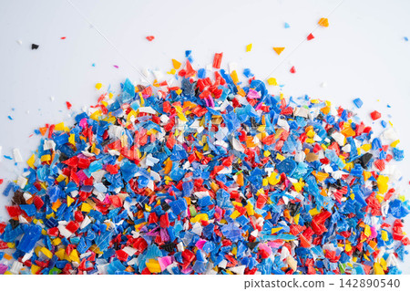Plastic colorful pieces recycling shredded for industrial use. Plastic colorful pieces recycling shredded for industrial use. 142890540