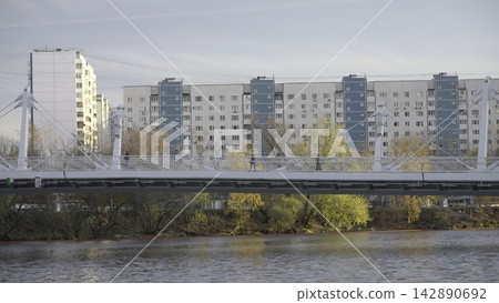 Serene River Scene. Peaceful Riverside Neighborhood Under Soft Morning Sky With Colorful Trees. Creative Serene River Scene. Peaceful Riverside Neighborhood Under Soft Morning Sky With Colorful Trees. Creative 142890692