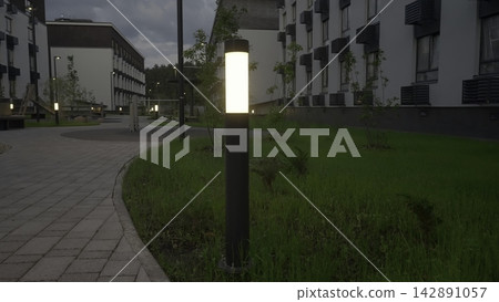 Nighttime Pathway With Lighting. Twilight Residential Exterior Showcasing Illuminated Pathway Design. Stock Clip Nighttime Pathway With Lighting. Twilight Residential Exterior Showcasing Illuminated Pathway Design. Stock Clip 142891057