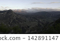 Tranquil Scene Featuring Vast Canyon With Stratified Formations Bathed In Warm Sunset Glow From Drone View. Creative 142891147
