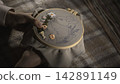 An Upclose View Of Delicate Hand Embroidery Featuring Floral Bunny On Plaid Background With Soft Warm Lighting. Media 142891149