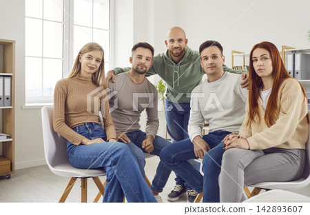 Group portrait of people, friends gathered together sitting close for communication 142893607
