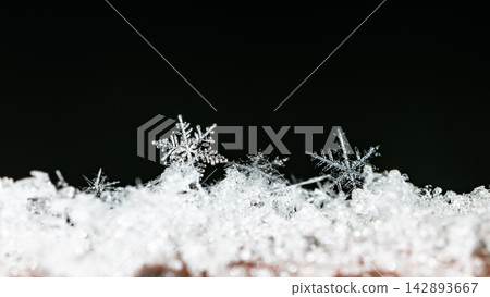 snapshot of a small snowflake taken during a snowfall snapshot of a small snowflake taken during a snowfall 142893667