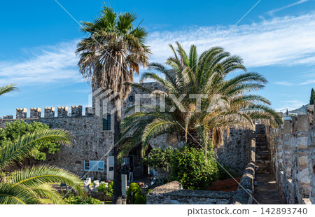 Castle courtyard with garden and ancient walls in Marmaris Turkey Castle courtyard with garden and ancient walls in Marmaris Turkey 142893740
