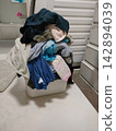 A huge pile of laundry 142894039