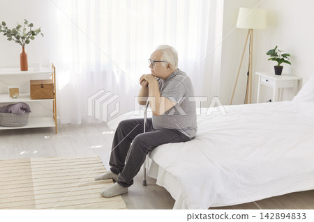 Senior old man alone at home, lonely pensive pleasant grandfather, elderly person retired patient Senior old man alone at home, lonely pensive pleasant grandfather, elderly person retired patient 142894833