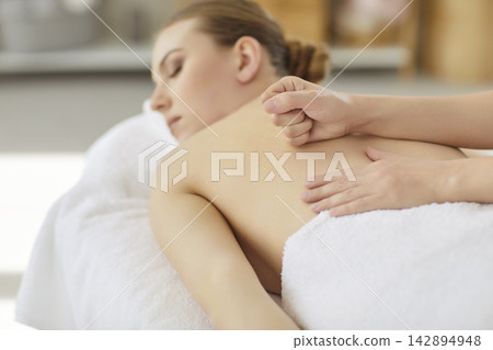 Professional back massage technique, body care and deep tissue therapy for woman Professional back massage technique, body care and deep tissue therapy for woman 142894948