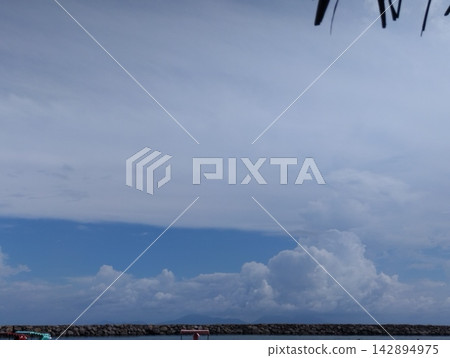 Dramatic Cumulonimbus Storm Clouds Gathering Under Thatched Roof Canopy Dramatic Cumulonimbus Storm Clouds Gathering Under Thatched Roof Canopy 142894975