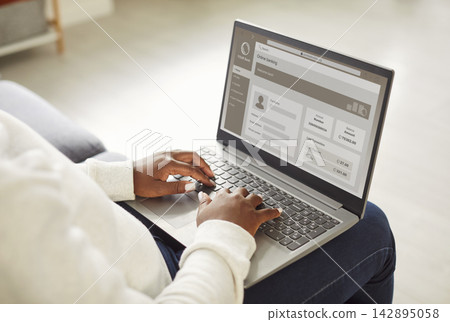 Woman doing online purchases enjoying online banking using laptop at home. Woman doing online purchases enjoying online banking using laptop at home. 142895058