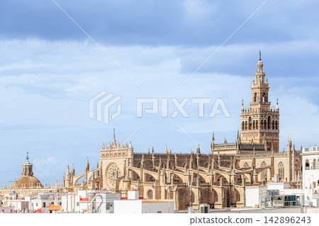 Giralda, the bell tower of Seville Cathedral in Seville, Spain Giralda, the bell tower of Seville Cathedral in Seville, Spain 142896243