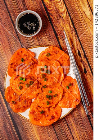 Freshly cooked savory korean pancakes kimchi jeon. Freshly cooked savory korean pancakes kimchi jeon. 142896373