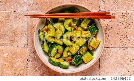 Chinese smashed cucumber salad with sesame 142896432