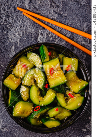 Chinese smashed cucumber salad with sesame Chinese smashed cucumber salad with sesame 142896435