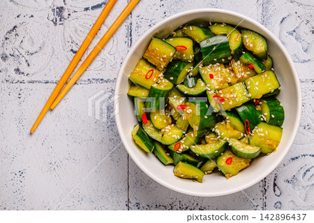 Chinese smashed cucumber salad with sesame Chinese smashed cucumber salad with sesame 142896437