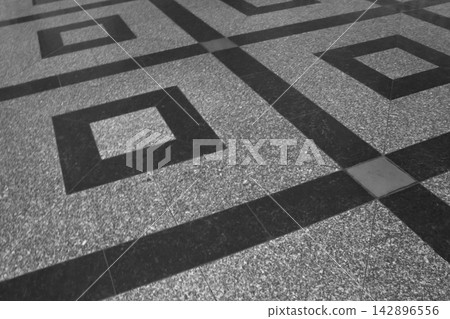 Geometric Pattern on a Textured Floor Surface Geometric Pattern on a Textured Floor Surface 142896556