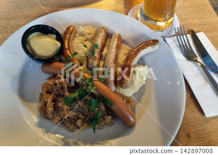 Traditional German Sausage Platter with Mustard and Beer for Oktoberfest Celebration Traditional German Sausage Platter with Mustard and Beer for Oktoberfest Celebration 142897008