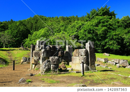 The Hashino blast furnace ruins, surrounded by fresh greenery. The Hashino blast furnace ruins, surrounded by fresh greenery. 142897363