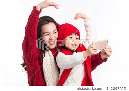 Asian Mother and Daughter Taking Selfie Together During Holiday Asian Mother and Daughter Taking Selfie Together During Holiday 142897925