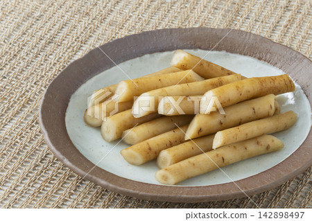 Pickled burdock root in soy sauce Pickled burdock root in soy sauce 142898497