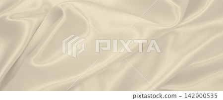 Smooth elegant golden silk or satin luxury cloth texture as wedding background. Luxurious Christmas background or New Year background design. In Sepia toned. Retro style Smooth elegant golden silk or satin luxury cloth texture as wedding background. Luxurious Christmas background or New Year background design. In Sepia toned. Retro style 142900535