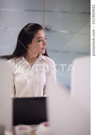 Middle Eastern businesswoman in a modern open office during a startup meeting looking thoughtful Middle Eastern businesswoman in a modern open office during a startup meeting looking thoughtful 142900682