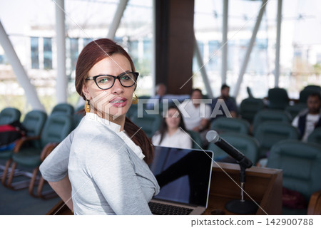 Middle Eastern businesswoman giving presentation at a startup meeting in a modern open corporate office Middle Eastern businesswoman giving presentation at a startup meeting in a modern open corporate office 142900788