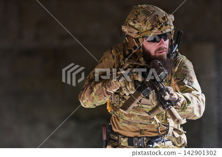 Tactical Soldier In Camouflage Gear Armed With Rifle During Urban Military Operation Tactical Soldier In Camouflage Gear Armed With Rifle During Urban Military Operation 142901302