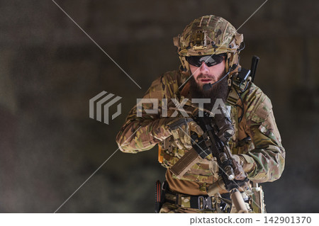 Special Forces Soldier In Tactical Gear With Rifle During Urban Operation Camouflage Portrait Special Forces Soldier In Tactical Gear With Rifle During Urban Operation Camouflage Portrait 142901370