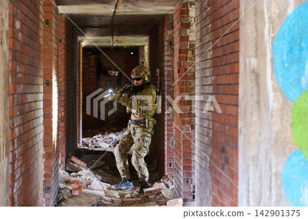 Tactical Soldier Clearing An Abandoned Brick Corridor During Urban Combat Training Exercise Tactical Soldier Clearing An Abandoned Brick Corridor During Urban Combat Training Exercise 142901375