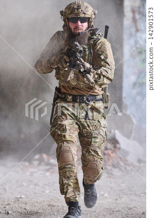 Armed Soldier In Tactical Gear Running Forward With Rifle During Urban Military Operation Armed Soldier In Tactical Gear Running Forward With Rifle During Urban Military Operation 142901573