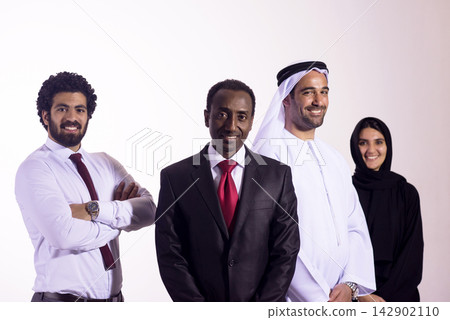 Multicultural business team of professionals smiling in formal and traditional attire in studio portrait Multicultural business team of professionals smiling in formal and traditional attire in studio portrait 142902110
