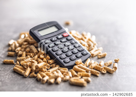 Calculator and Wood Pellets for Heating Cost Calculation Renewable Energy Fuel Savings and Budget Planning 142902685