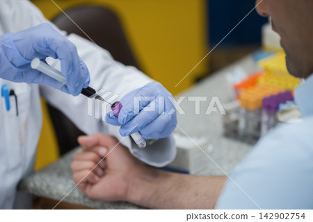 Middle Eastern young doctors and medical technician performing blood testing and sample collection in a clinical lab Middle Eastern young doctors and medical technician performing blood testing and sample collection in a clinical lab 142902754