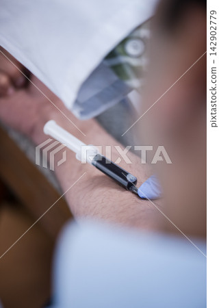 Young Middle Eastern medical technician and doctor performing blood test and sample collection in laboratory Young Middle Eastern medical technician and doctor performing blood test and sample collection in laboratory 142902779