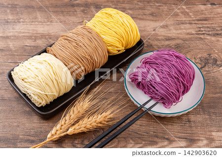 assorted Colored Dried Cantonese Jook Sing Noodle Cakes assorted Colored Dried Cantonese Jook Sing Noodle Cakes 142903620