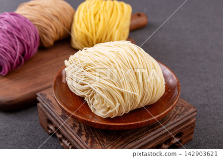 assorted Colored Dried Cantonese Jook Sing Noodle Cakes assorted Colored Dried Cantonese Jook Sing Noodle Cakes 142903621