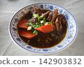 Beef noodle soup (niu rou mian), a classic Taiwanese dish. 142903832