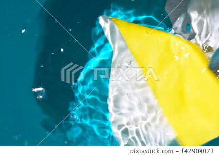 Abstract photograph of water with vibrant, iridescent colors. Abstract photograph of water with vibrant, iridescent colors. 142904071