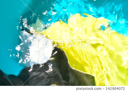 Abstract photograph of water with vibrant, iridescent colors. Abstract photograph of water with vibrant, iridescent colors. 142904072