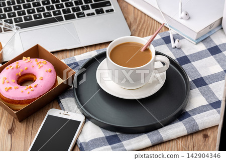 coffee Donut And Digital Devices On Breakfast Table coffee Donut And Digital Devices On Breakfast Table 142904346