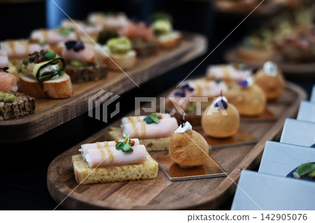 Elegant shrimp appetizers in clear cups served at a catered party or wedding reception buffet Elegant shrimp appetizers in clear cups served at a catered party or wedding reception buffet 142905076