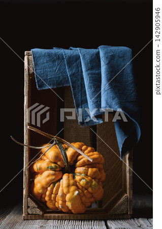 Ornamental gourds arranged inside rustic wooden crate Ornamental gourds arranged inside rustic wooden crate 142905946