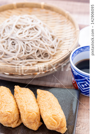 A set of delicious soba noodles and inari sushi. A set of delicious soba noodles and inari sushi. 142906095