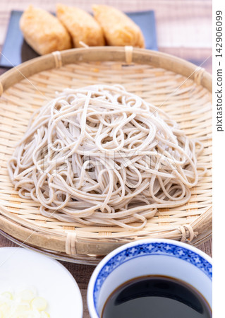 A set of delicious soba noodles and inari sushi. A set of delicious soba noodles and inari sushi. 142906099