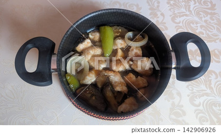 Simmered fried chicken breast and vegetables with dashi broth in a pot Simmered fried chicken breast and vegetables with dashi broth in a pot 142906926