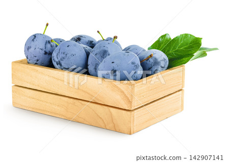 fresh blue plum in wooden box isolated on white background fresh blue plum in wooden box isolated on white background 142907141