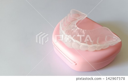 Mouthguard for preventing teeth grinding and pink storage case Mouthguard for preventing teeth grinding and pink storage case 142907378